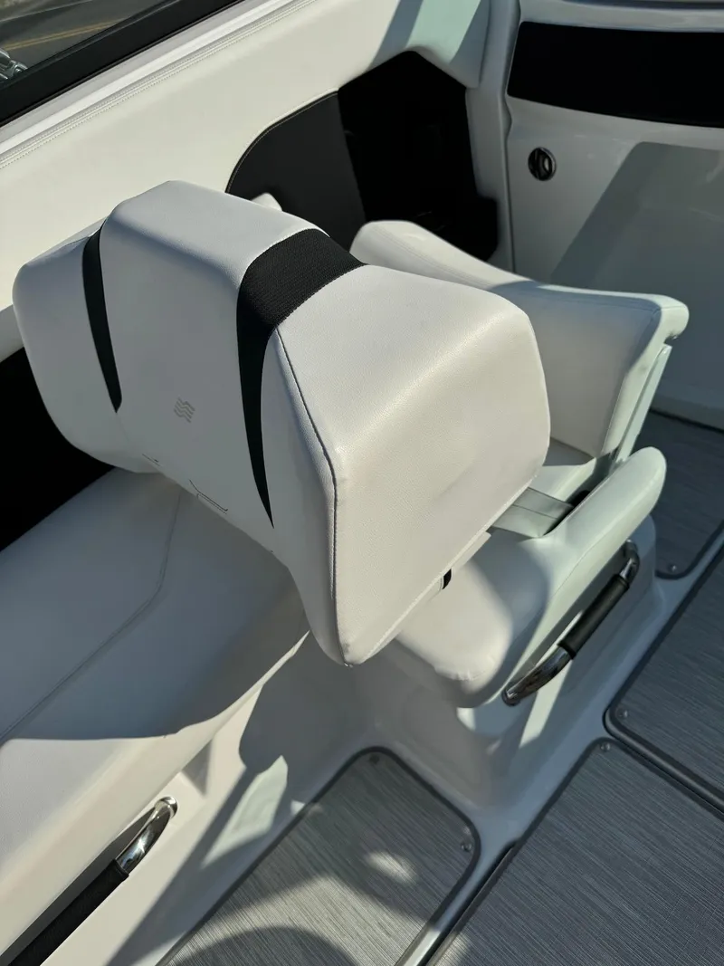 Slide: The Image of 2025 Four Winns H6 OB boat seat with white upholstery and modern design. - 15