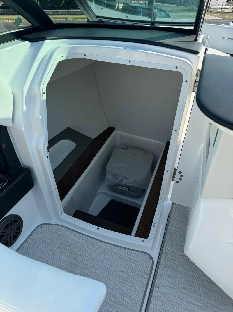 Slide: The Image of 2025 Four Winns H6 OB boat interior storage compartment. - 18