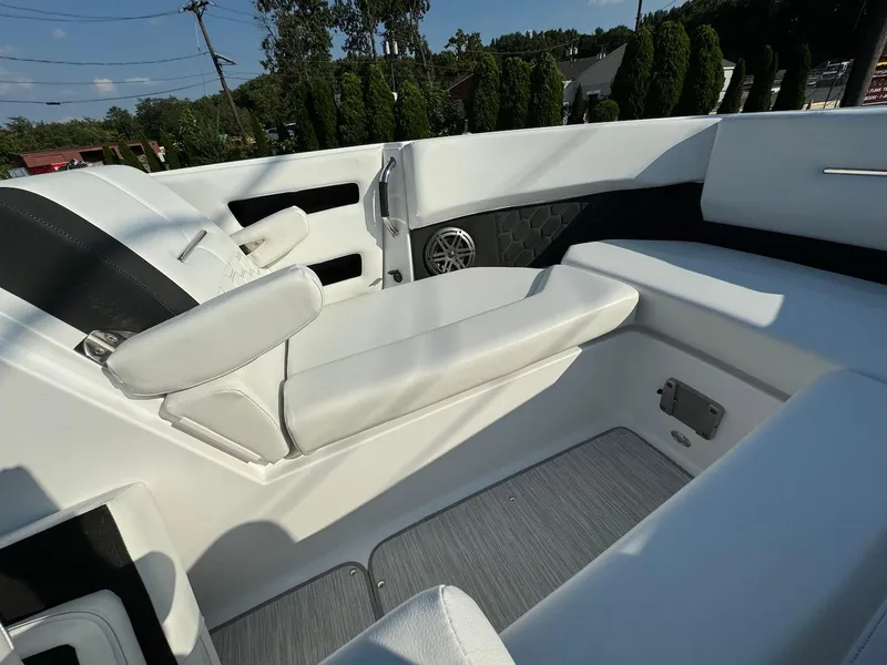 Slide: The Image of 2025 Four Winns H6 OB boat interior with white seating and modern design. - 24