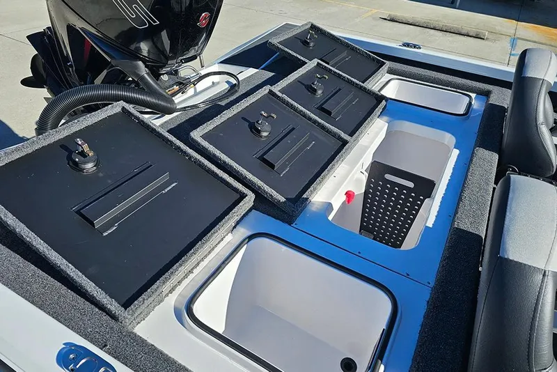 Slide: The Image of 2026 Vexus Defender 189 boat storage compartments and seating area. - 11