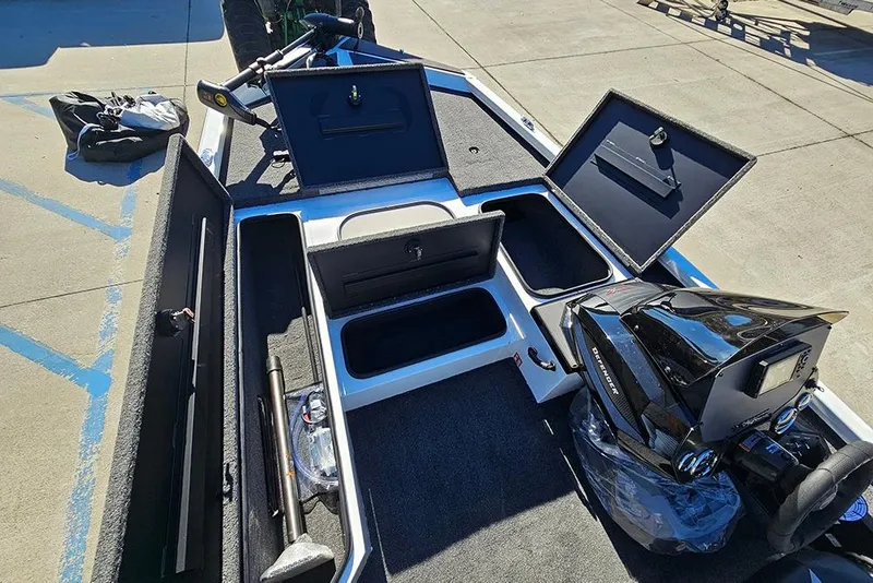 Slide: The Image of 2026 Vexus Defender 189 boat interior with open storage compartments and equipment. - 19