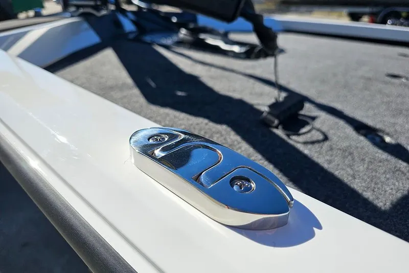 Slide: The Image of 2026 Vexus Defender 189 boat detail with chrome hardware and carpeted deck. - 23