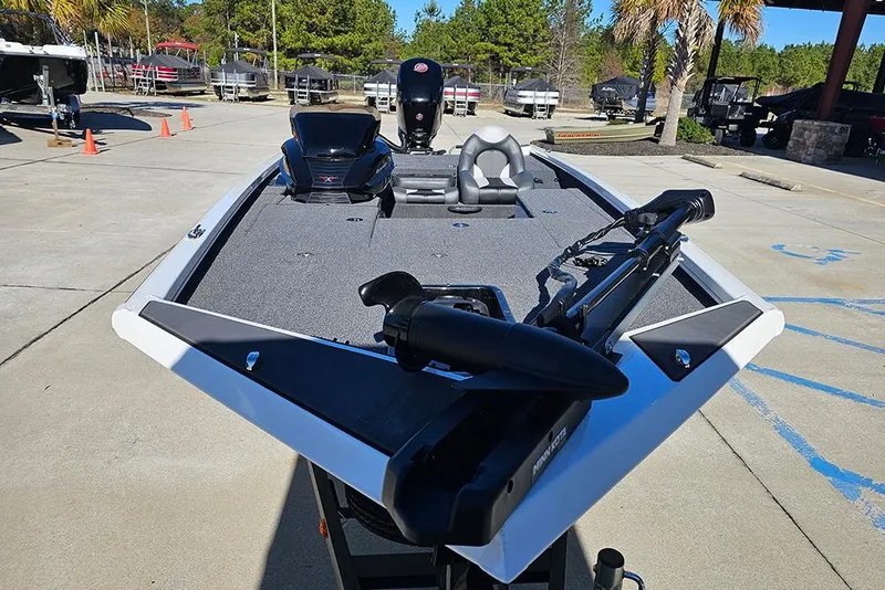 Slide: The Image of 2026 Vexus Defender 189 boat with advanced features, parked outdoors. - 4