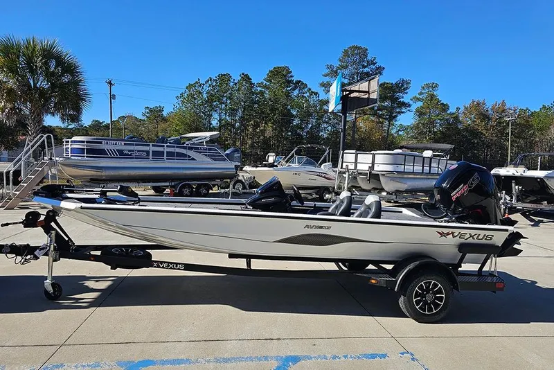 Slide: The Image of 2026 Vexus Defender 189 boat on trailer in outdoor showroom. - 6