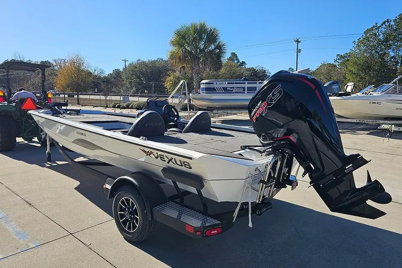 Slide: The Image of 2026 Vexus Defender 189 boat on trailer with powerful outboard motor. - 7