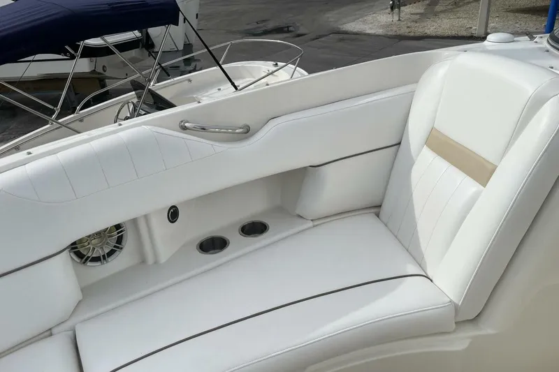 Slide: The Image of Luxurious seating on 2008 Sea Ray 270 SLX boat with white upholstery and cup holders. - 23