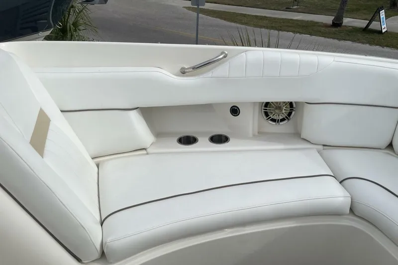 Slide: The Image of 2008 Sea Ray 270 SLX boat interior with white seating and cup holders. - 24