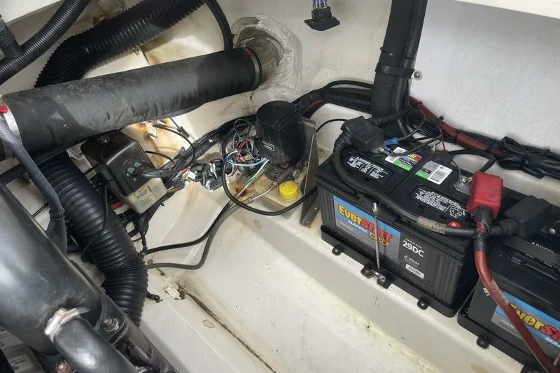 Slide: The Image of Engine compartment of a 2008 Sea Ray 270 SLX with batteries and wiring. - 27