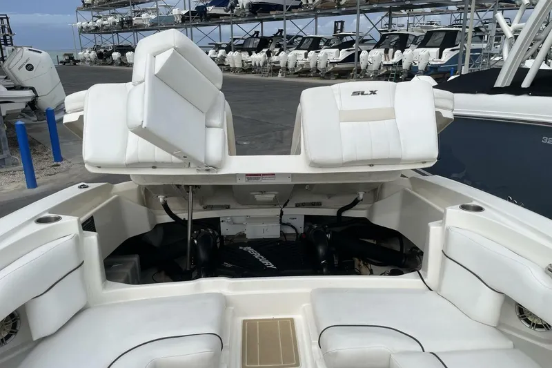 Slide: The Image of 2008 Sea Ray 270 SLX boat interior with white seating and engine compartment. - 30