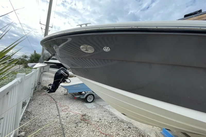 Slide: The Image of 2008 Sea Ray 270 SLX boat on trailer, side view with cloudy sky background. - 6