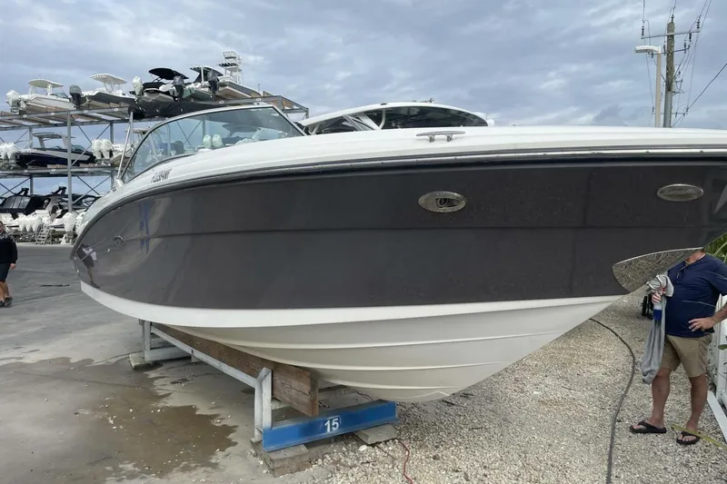 Slide: The Image of 2008 Sea Ray 270 SLX boat on dry dock, cloudy sky background. - 8