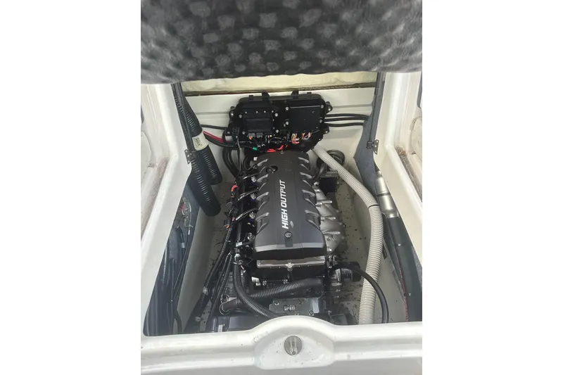 Slide: The Image of Engine compartment of a 2017 Yamaha Boats AR190, featuring a high output engine. - 10