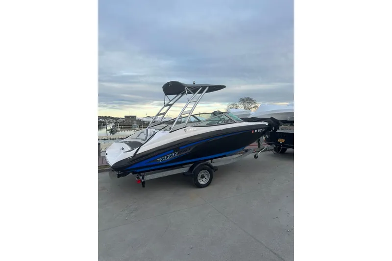 Slide: The Image of 2017 Yamaha Boats AR190 on trailer, dockside view, overcast sky. - 3
