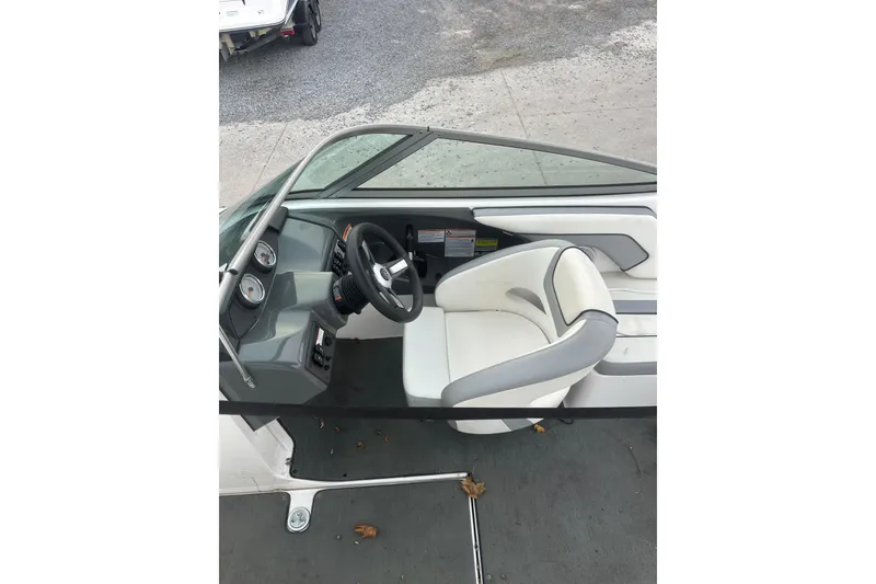 Slide: The Image of 2017 Yamaha Boats AR190 cockpit with steering wheel and white seating. - 8