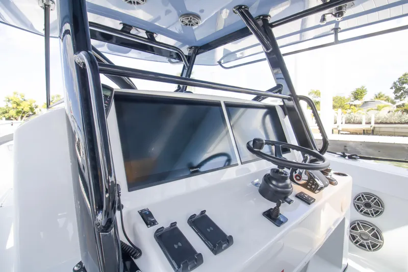 Slide: The Image of Interior view of 2026 Yellowfin 42 Offshore boat cockpit with navigation equipment. - 13