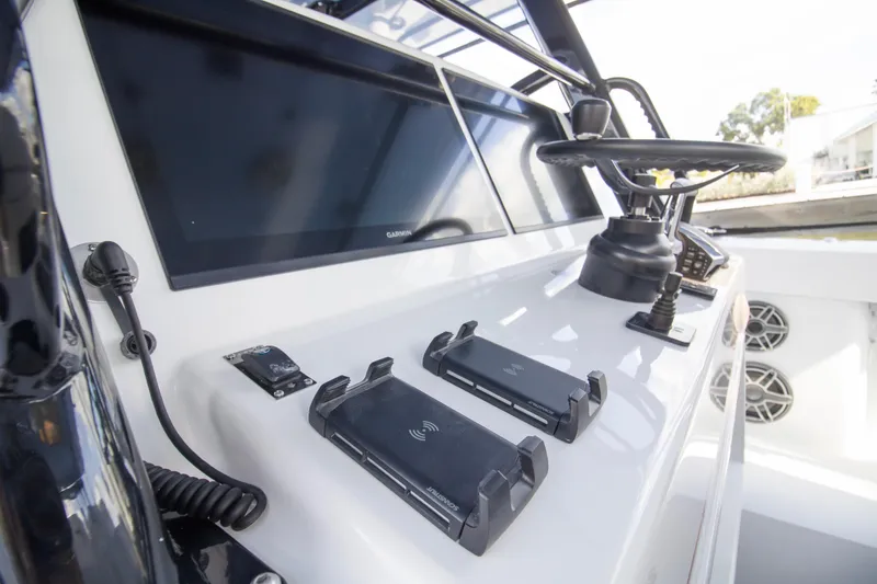 Slide: The Image of 2026 Yellowfin 42 Offshore boat interior with branded seating, dockside view. - 15