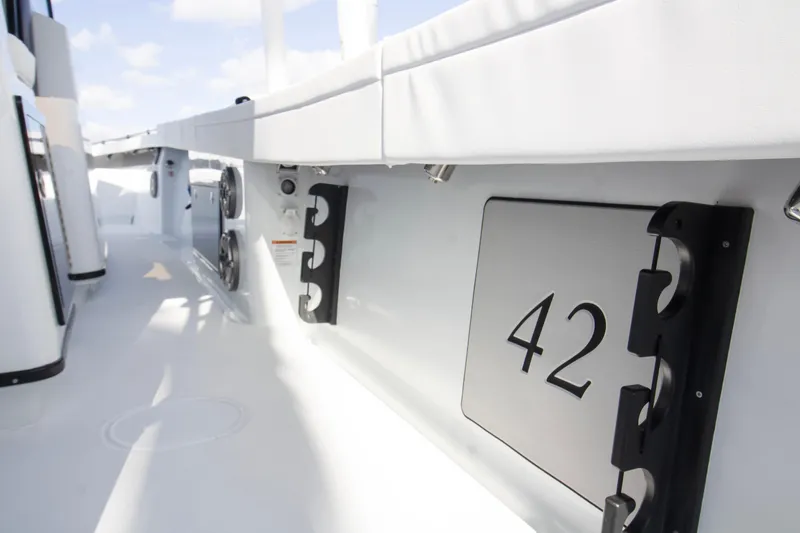 Slide: The Image of 2026 Yellowfin 42 Offshore boat with sleek white interior and outdoor grill station. - 22