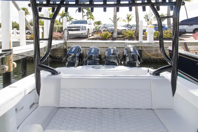 Slide: The Image of 2026 Yellowfin 42 Offshore boat with four powerful Mercury outboard engines docked. - 24