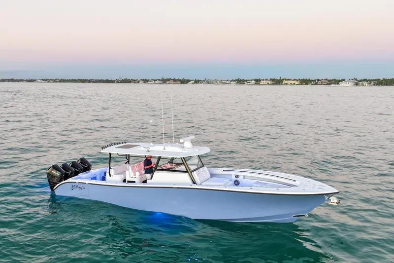 Slide: The Image of 2026 Yellowfin 42 Offshore boat cruising on calm waters at sunset. - 26