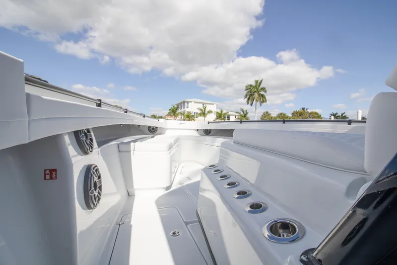 Slide: The Image of 2026 Yellowfin 42 Offshore boat docked at marina with palm trees. - 6