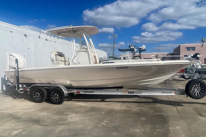 The Image of 2022 Pathfinder 2600 TRS boat on trailer under blue sky. - 1