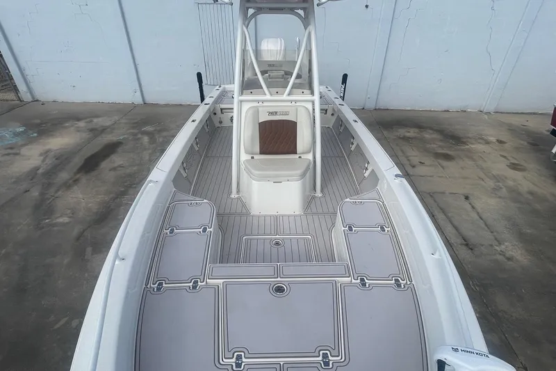 Slide: The Image of 2022 Pathfinder 2600 TRS boat interior with spacious deck and seating. - 13