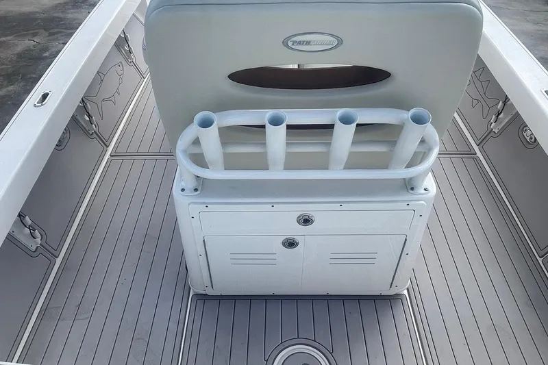 Slide: The Image of 2022 Pathfinder 2600 TRS boat interior with rod holders and storage compartments. - 15