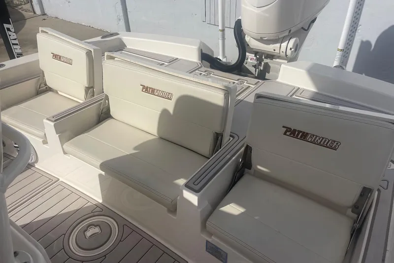 Slide: The Image of 2022 Pathfinder 2600 TRS boat seating area with branded cushions and modern design. - 5