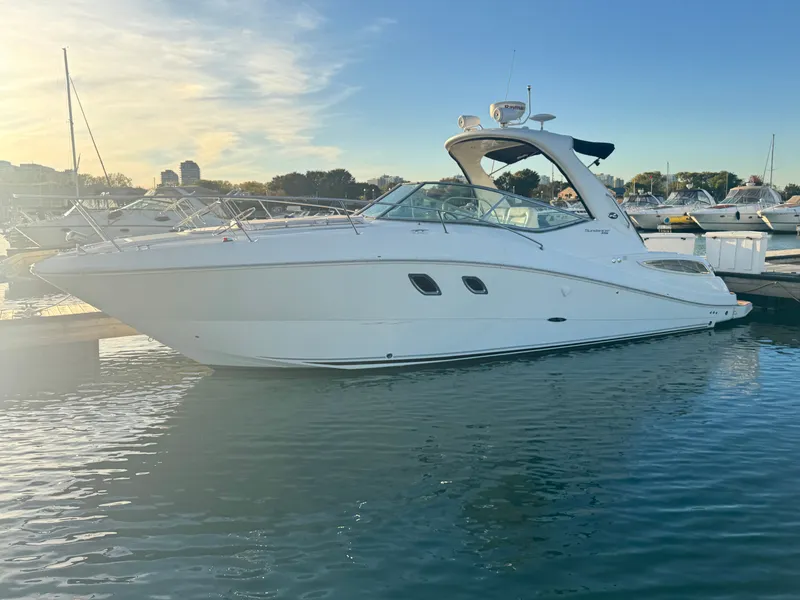 The Image of 2011 Sea Ray 330 Sundancer docked at sunset. - 0