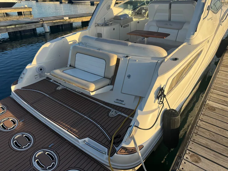 Slide: The Image of 2011 Sea Ray 330 Sundancer at dock, luxury boat deck. - 1