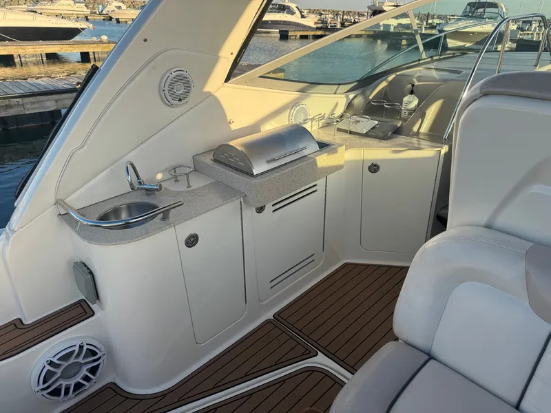 Slide: The Image of Interior of 2011 Sea Ray 330 Sundancer with kitchenette and sink. - 10