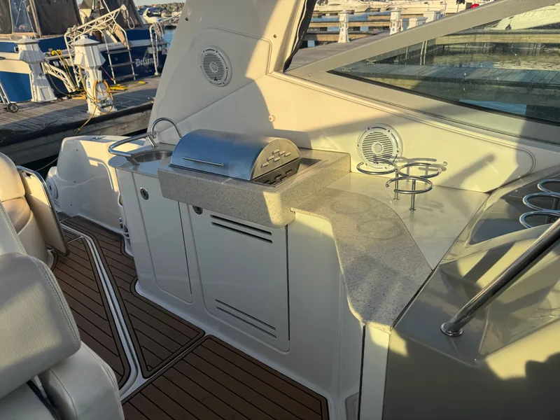 Slide: The Image of Sea Ray 330 Sundancer 2011 with grill and cup holders. - 11