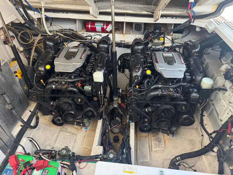 Slide: The Image of Engine room of a 2011 Sea Ray 330 Sundancer boat with twin engines. - 21