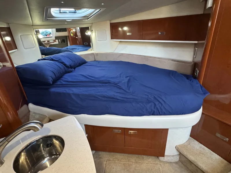 Slide: The Image of Interior of 2011 Sea Ray 330 Sundancer with bed and sink. - 3