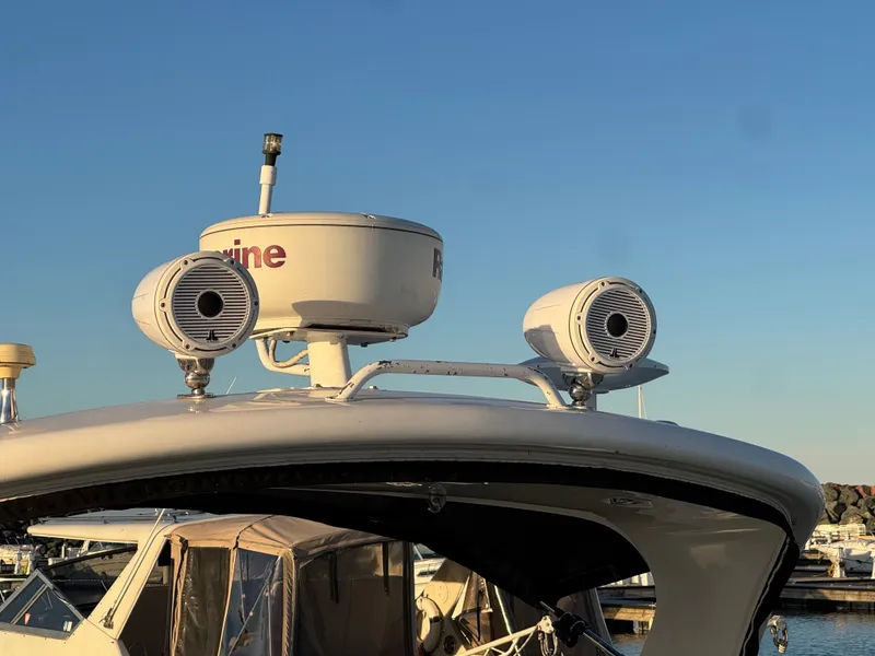 Slide: The Image of Sea Ray 330 Sundancer 2011 with radar equipment at the marina. - 4