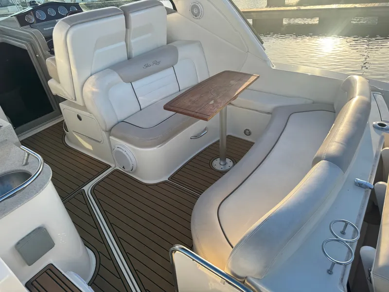 Slide: The Image of Interior of 2011 Sea Ray 330 Sundancer with seating area and table. - 9