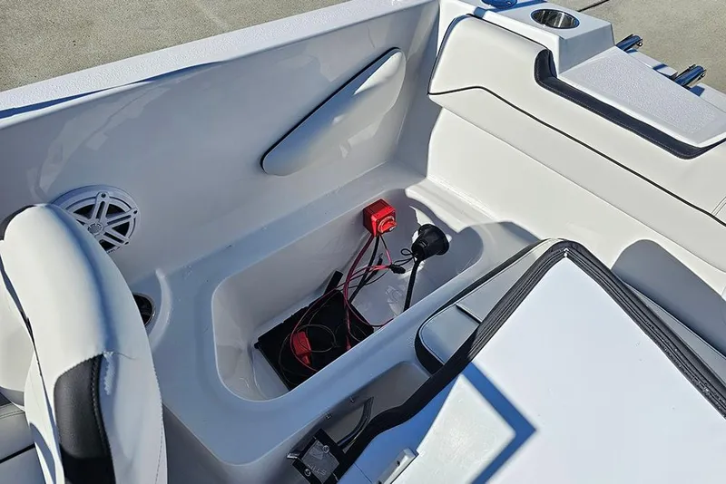 Slide: The Image of Interior of 2026 Stingray 172 DC boat showing seating and storage compartment. - 13