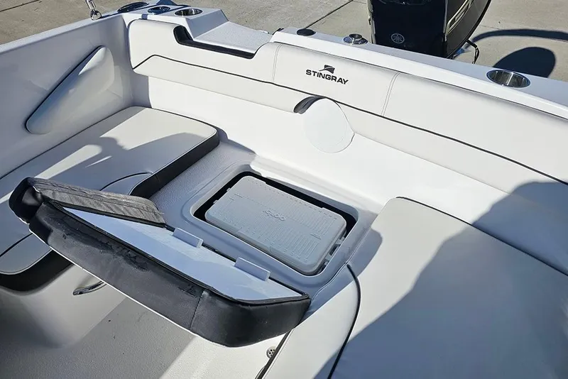 Slide: The Image of 2026 Stingray 172 DC boat interior with storage compartment and seating. - 14