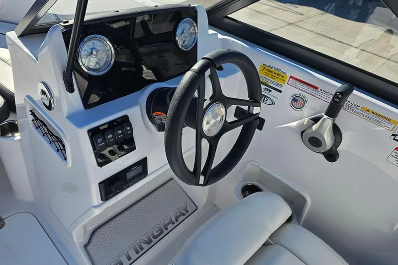 Slide: The Image of 2026 Stingray 172 DC boat dashboard with steering wheel and control panel. - 18