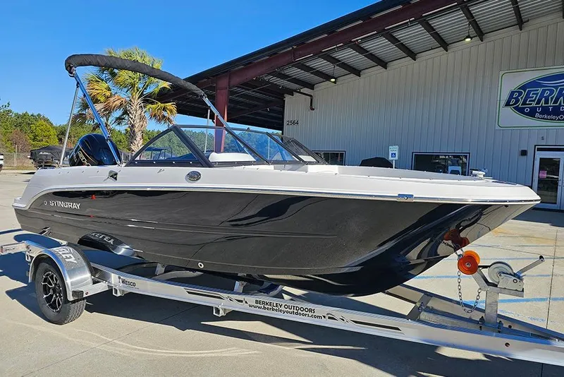 Slide: The Image of 2026 Stingray 172 DC boat on trailer outside dealership. - 2