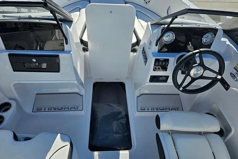 Slide: The Image of 2026 Stingray 172 DC boat interior with steering wheel and dashboard controls. - 21