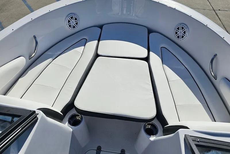 Slide: The Image of 2026 Stingray 172 DC boat interior with white cushioned seating and cup holders. - 22