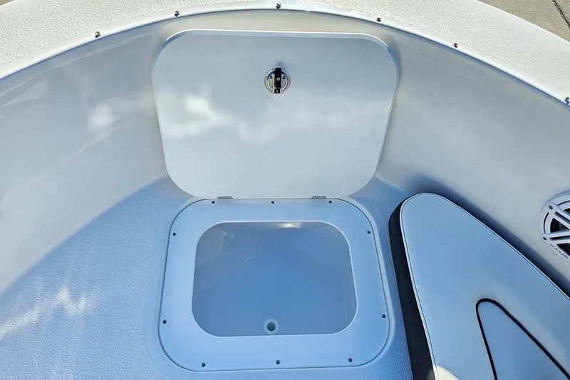 Slide: The Image of 2026 Stingray 172 DC boat storage compartment with open hatch, showcasing interior details. - 24