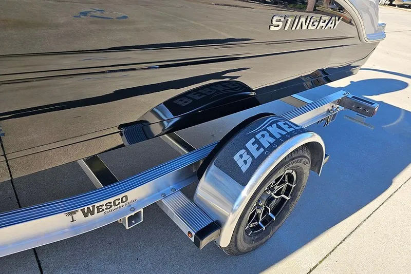 Slide: The Image of 2026 Stingray 172 DC boat on Wesco trailer, featuring Berkley Outdoors branding. - 27