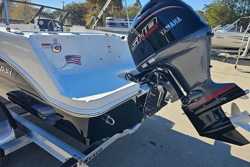 Slide: The Image of 2026 Stingray 172 DC boat with Yamaha outboard motor, displayed on a trailer. - 9