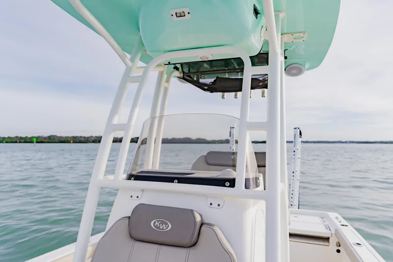Slide: The Image of 2024 Key West 250 Bay Reef boat on calm water, featuring sleek design and comfortable seating. - 20
