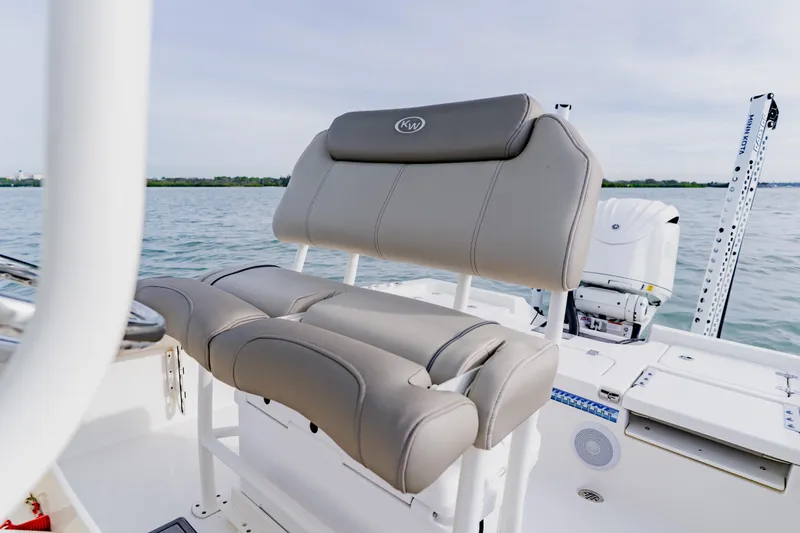 Slide: The Image of 2024 Key West 250 Bay Reef boat seat with water backdrop. - 23