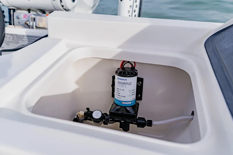 Slide: The Image of 2024 Key West 250 Bay Reef boat compartment with Shurflo Blaster II pump. - 32