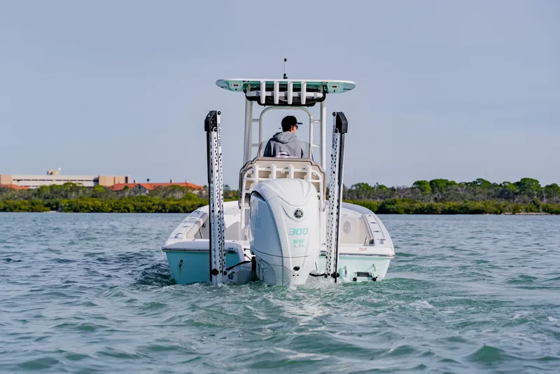 Slide: The Image of 2024 Key West 250 Bay Reef boat cruising on calm water. - 7