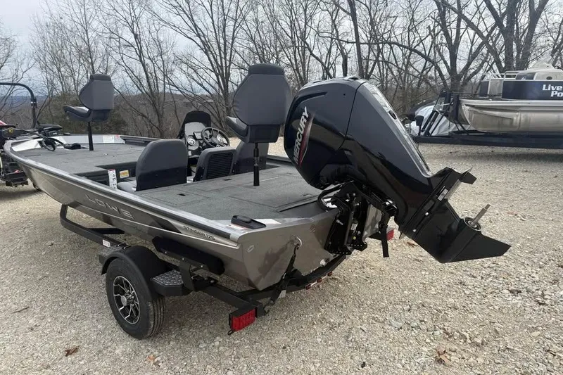 Slide: The Image of 2026 Lowe Stinger 175C boat with Mercury outboard motor on gravel. - 7